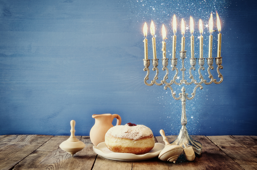 Menorah with dreidel and Sufganiyot 